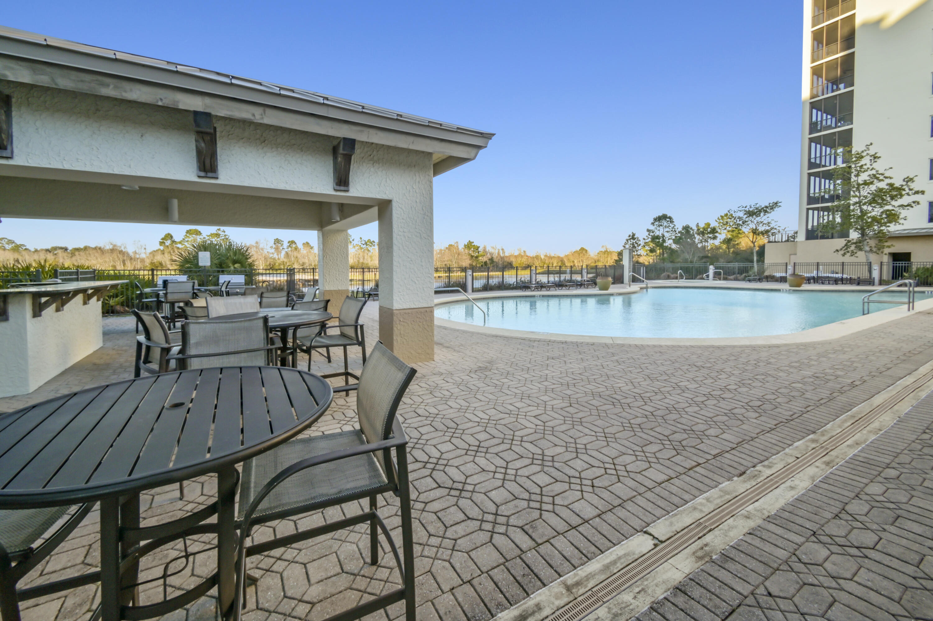 608 Lost Key Drive, Unit 801C Perdido Key, FL 32507 - Photo 36 of 43 a view of a swimming pool with outdoor seating