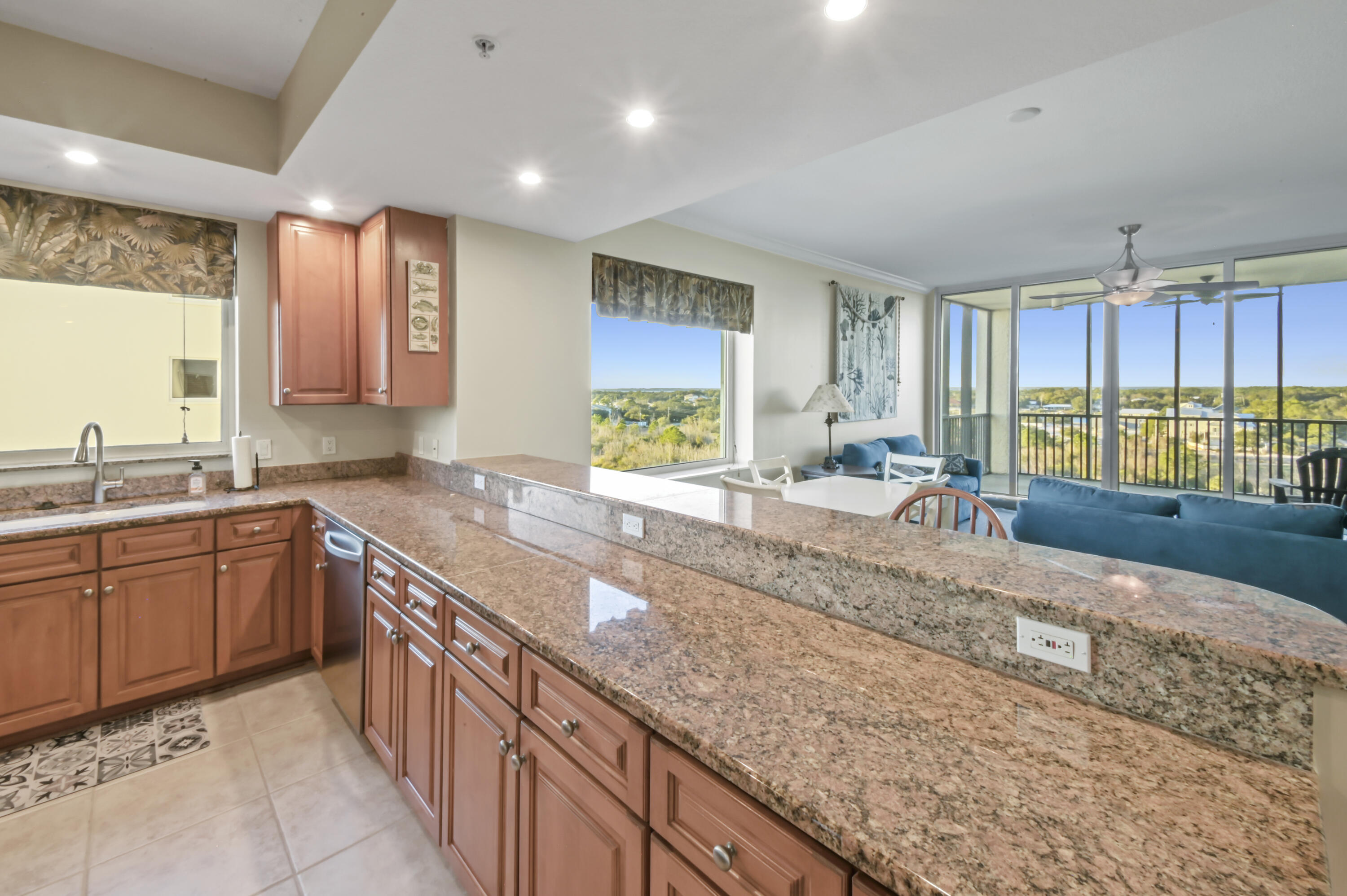 608 Lost Key Drive, Unit 801C Perdido Key, FL 32507 - Photo 6 of 43 a large kitchen with kitchen island granite countertop a large window