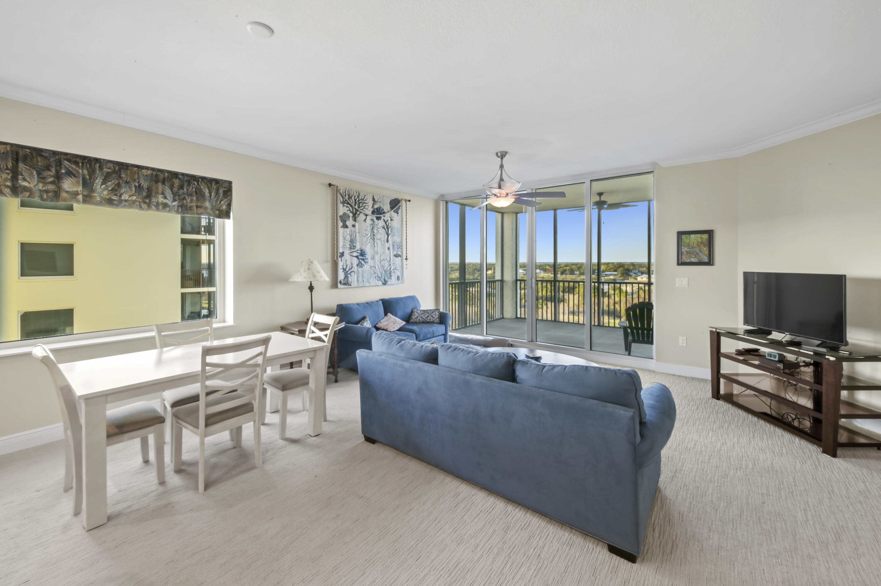 608 Lost Key Drive, Unit 801C Perdido Key, FL 32507 - Photo 7 of 43 a living room with furniture and a flat screen tv
