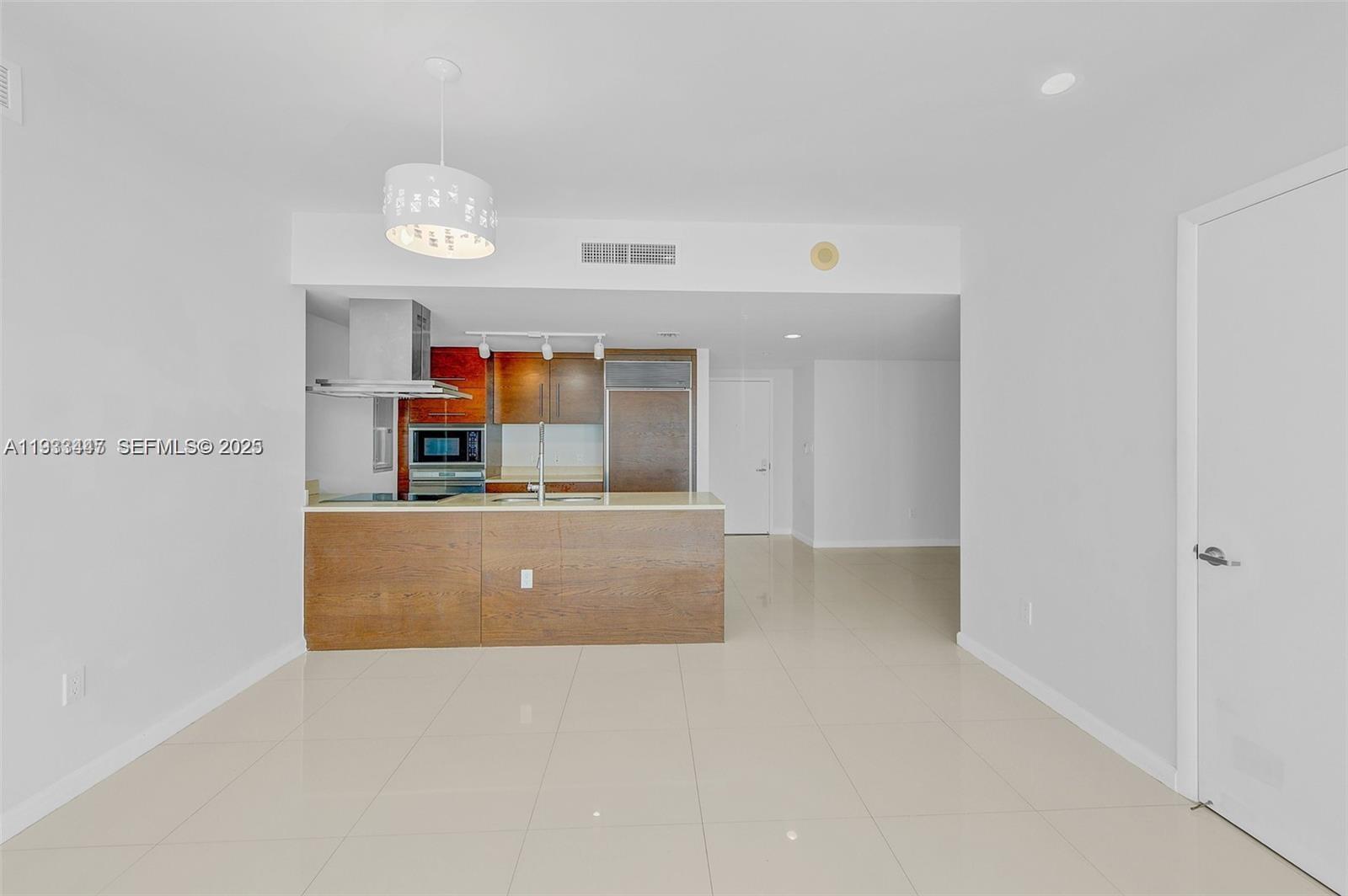 495 Brickell Avenue, Unit 2103 Miami, FL 33131 - Photo 12 of 37 a living room with a couch and a large window