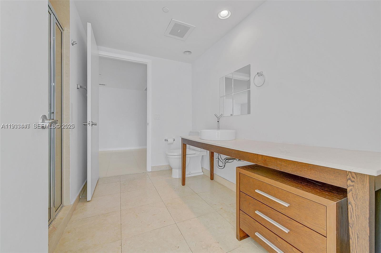 495 Brickell Avenue, Unit 2103 Miami, FL 33131 - Photo 20 of 37 a room view with wooden floor and furniture