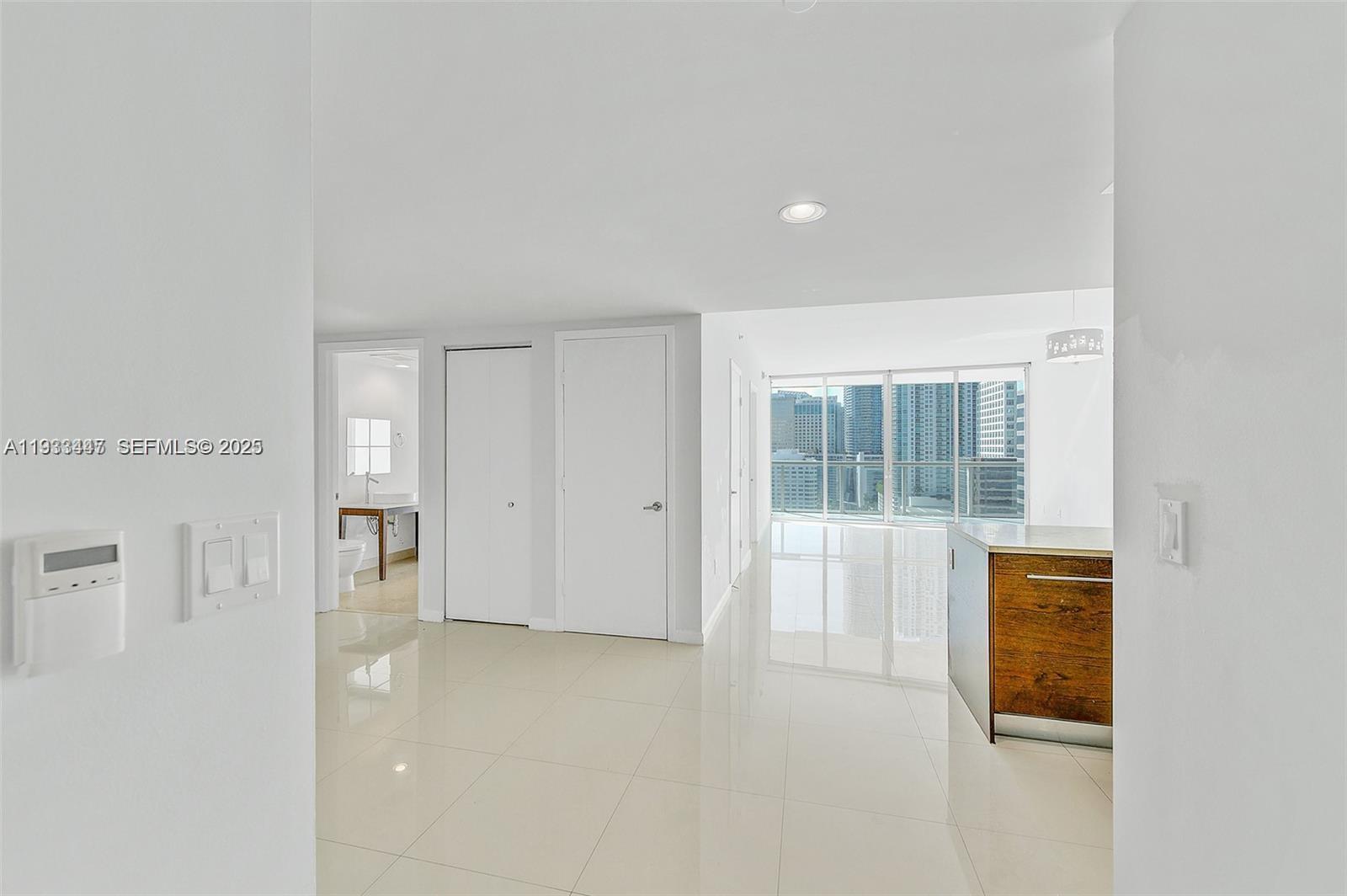 495 Brickell Avenue, Unit 2103 Miami, FL 33131 - Photo 2 of 37 a view of an empty room with a window