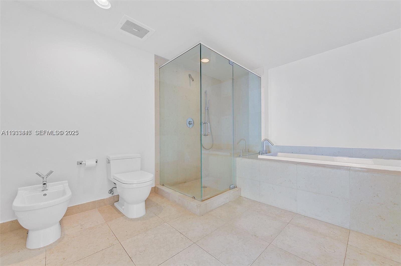 495 Brickell Avenue, Unit 2103 Miami, FL 33131 - Photo 27 of 37 a bathroom with a toilet and a shower