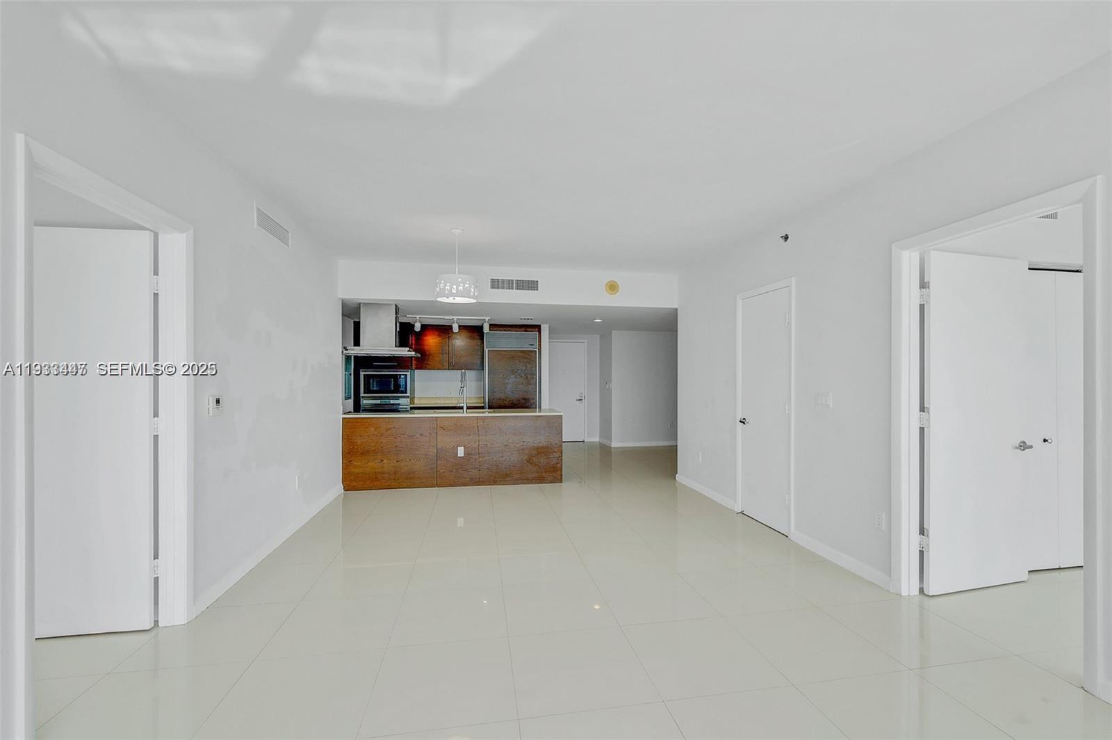495 Brickell Avenue, Unit 2103 Miami, FL 33131 - Photo 6 of 37 a view of kitchen and empty room