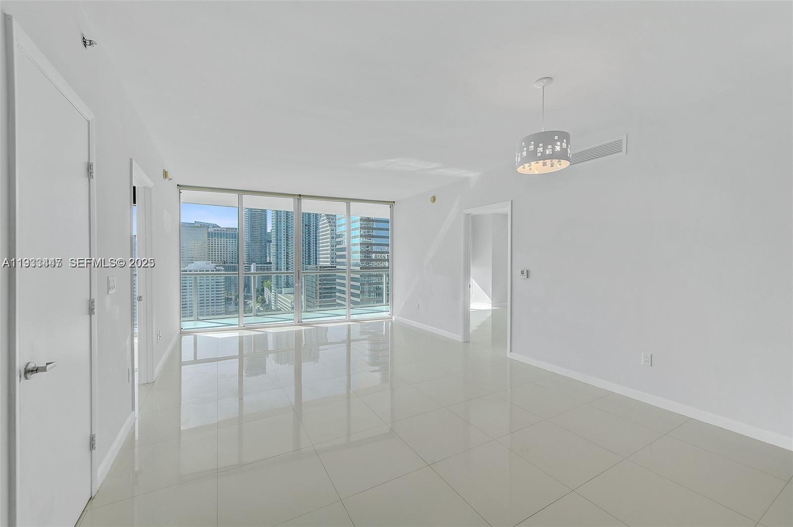 495 Brickell Avenue, Unit 2103 Miami, FL 33131 - Photo 7 of 37 a view of an empty room with a window