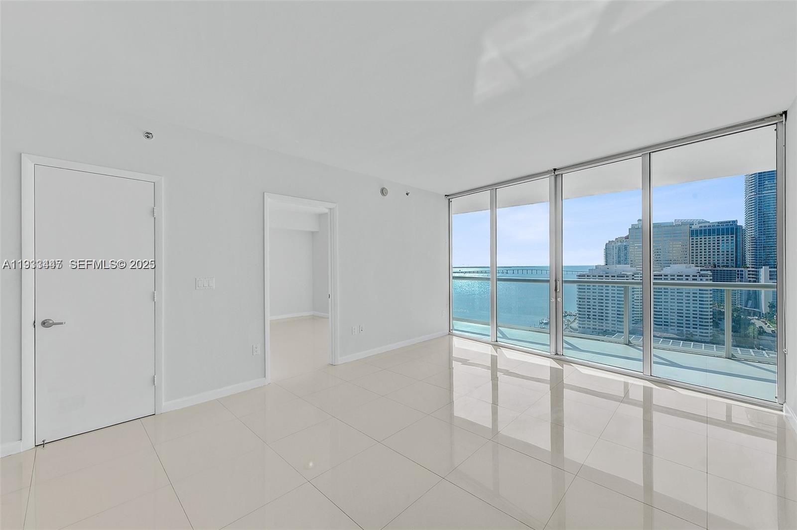 495 Brickell Avenue, Unit 2103 Miami, FL 33131 - Photo 10 of 37 a view of an empty room and window