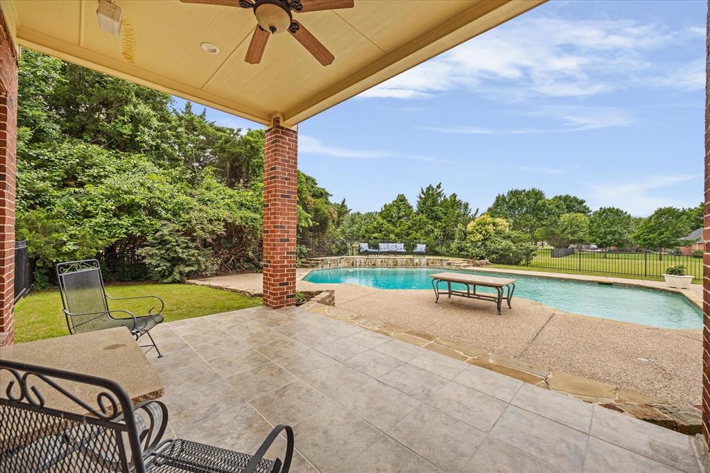 506 Meadowview Road Heath, TX 75032 - Photo 7 of 32 a view of a swimming pool with a patio