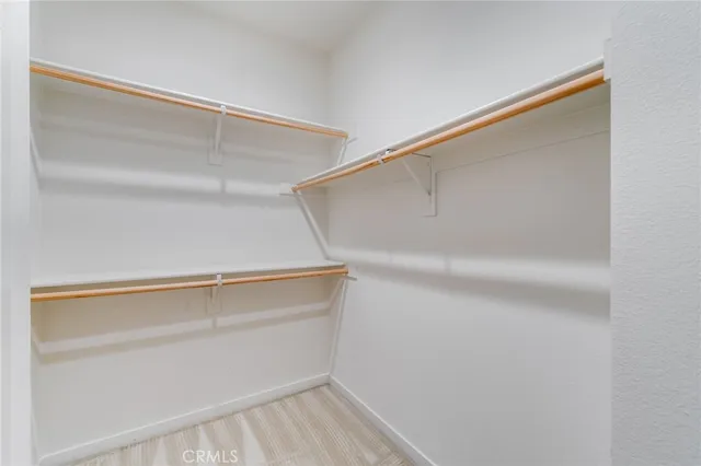 a view of an empty walk in closet