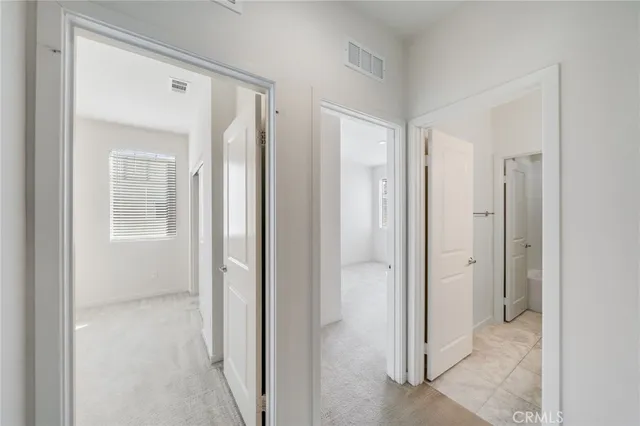 a view of a bathroom with a shower and a sink