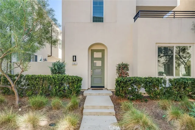 a view of a pathway with a garden