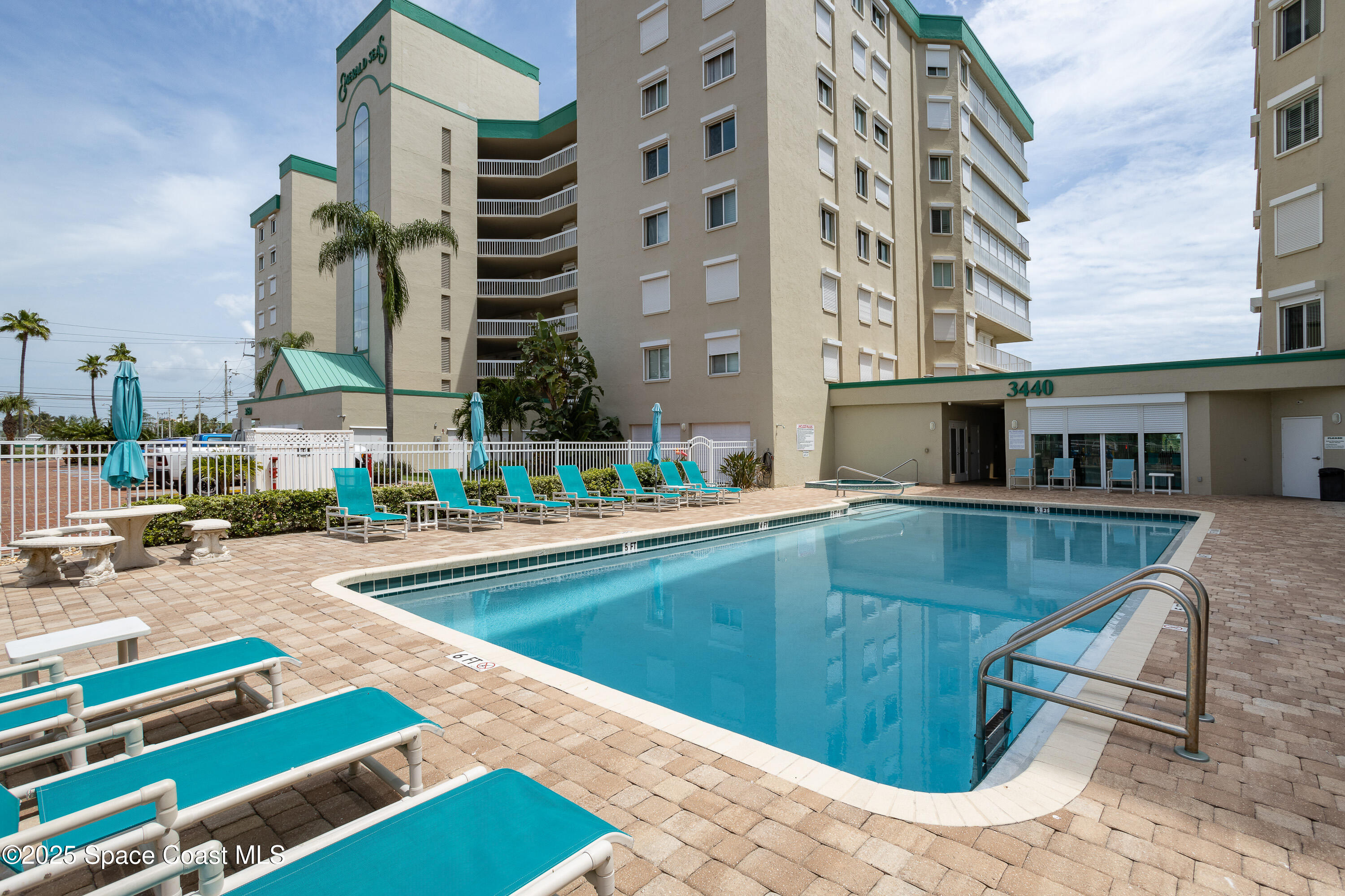3450 Ocean Beach Boulevard, Unit 201 Cocoa Beach, FL 32931 - Photo 1 of 48 Pool in front of building