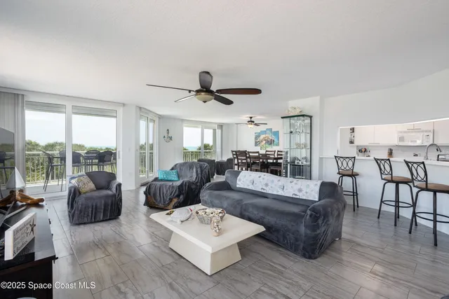 a view of a dining room and livingroom with furniture