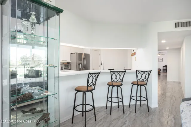 a bedroom with two beds and a large window