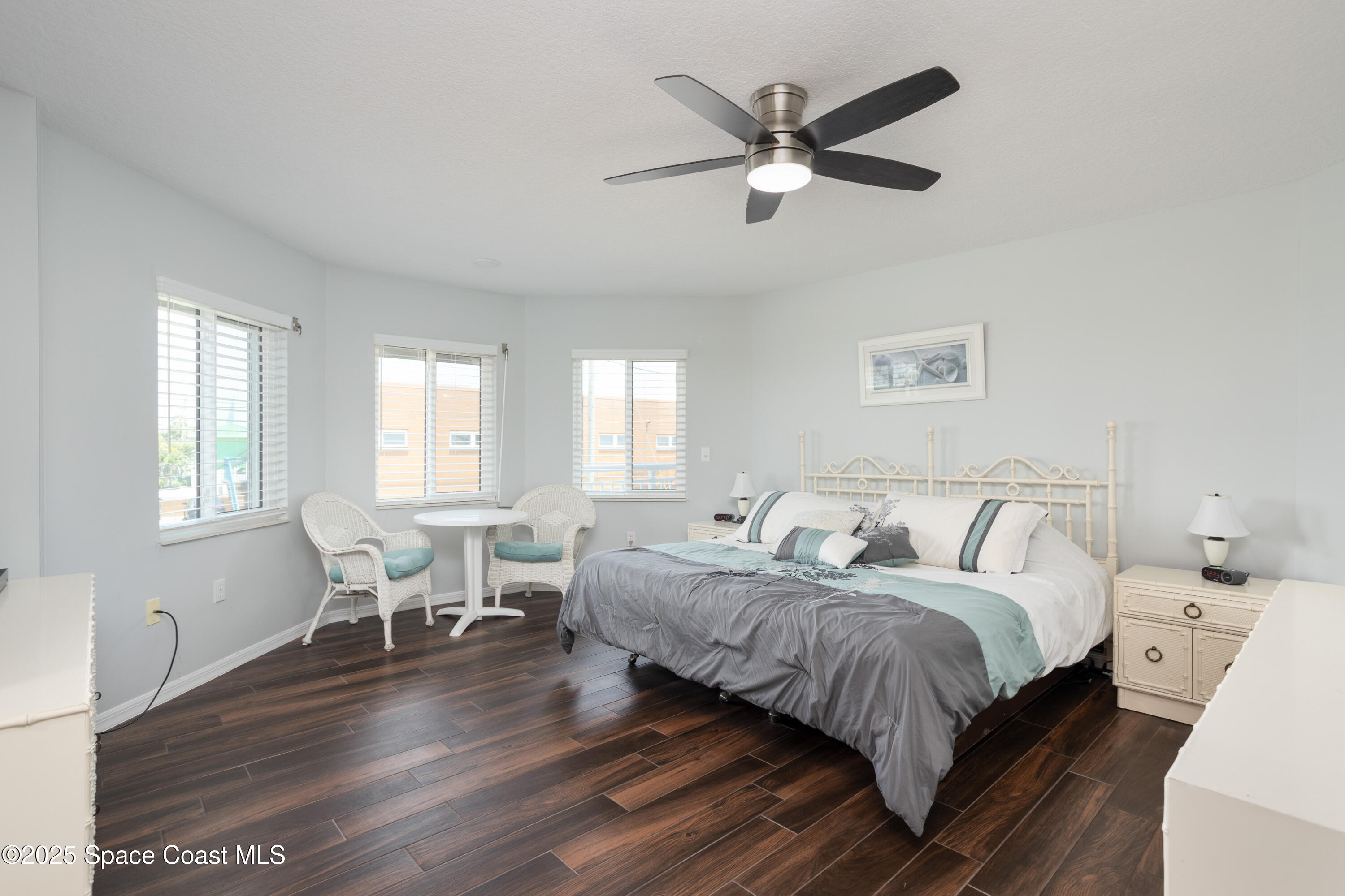 3450 Ocean Beach Boulevard, Unit 201 Cocoa Beach, FL 32931 - Photo 20 of 48 a bedroom with two beds and a large window
