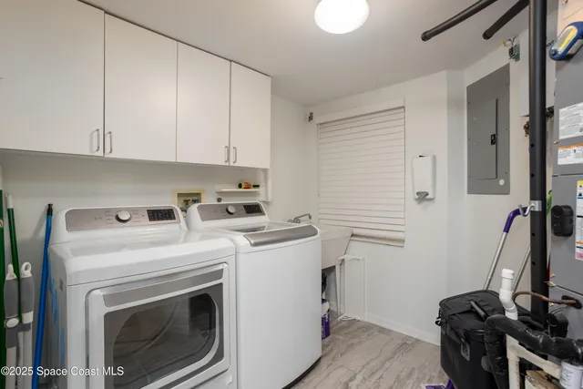 a bathroom with double vanity sinks a toilet a mirror and vanity