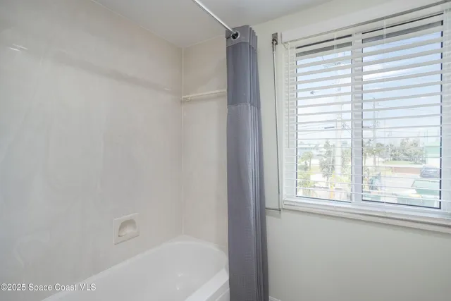 a view of a dining room with furniture and window