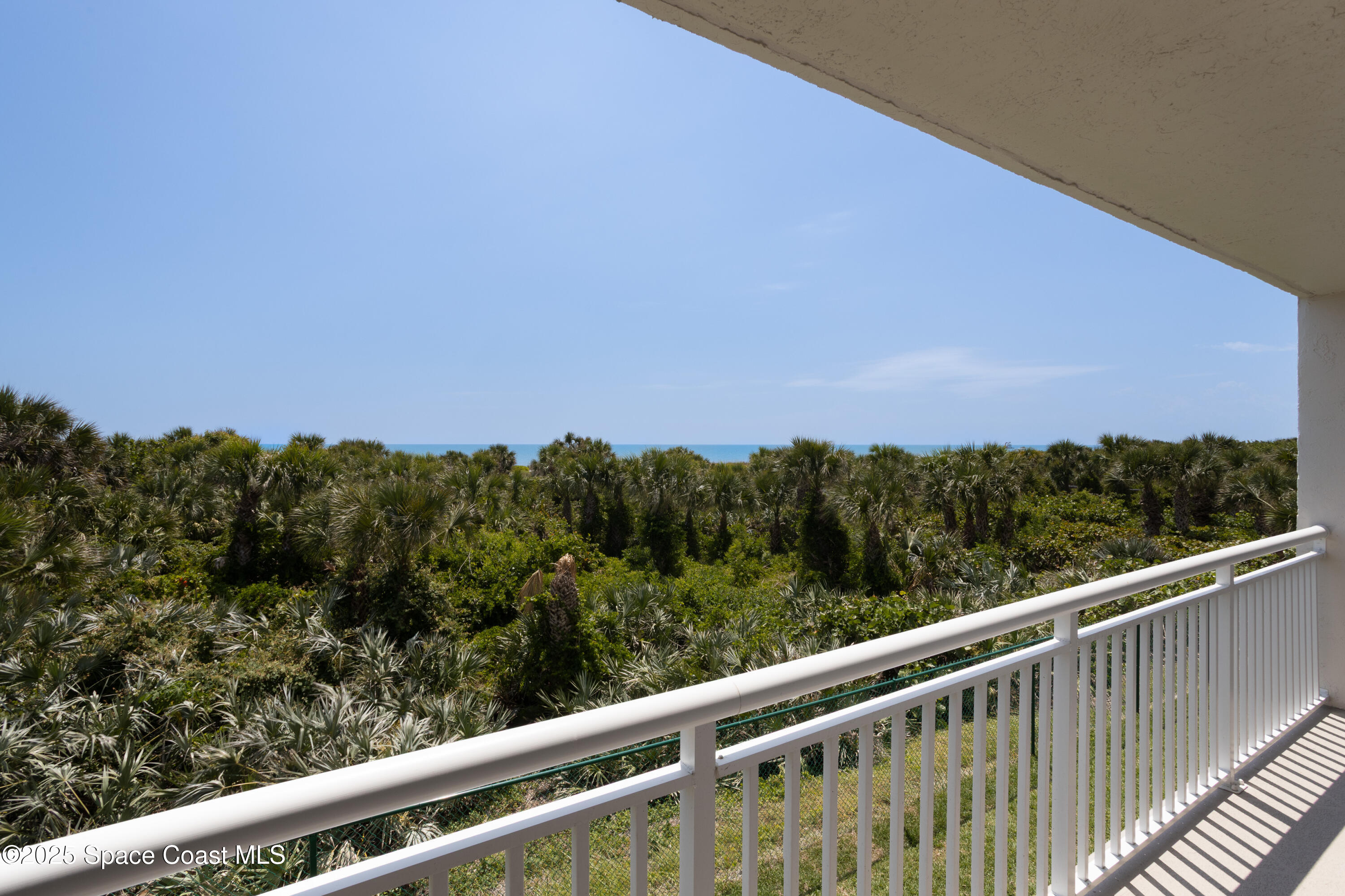 3450 Ocean Beach Boulevard, Unit 201 Cocoa Beach, FL 32931 - Photo 4 of 48 a view of a balcony with outdoor space