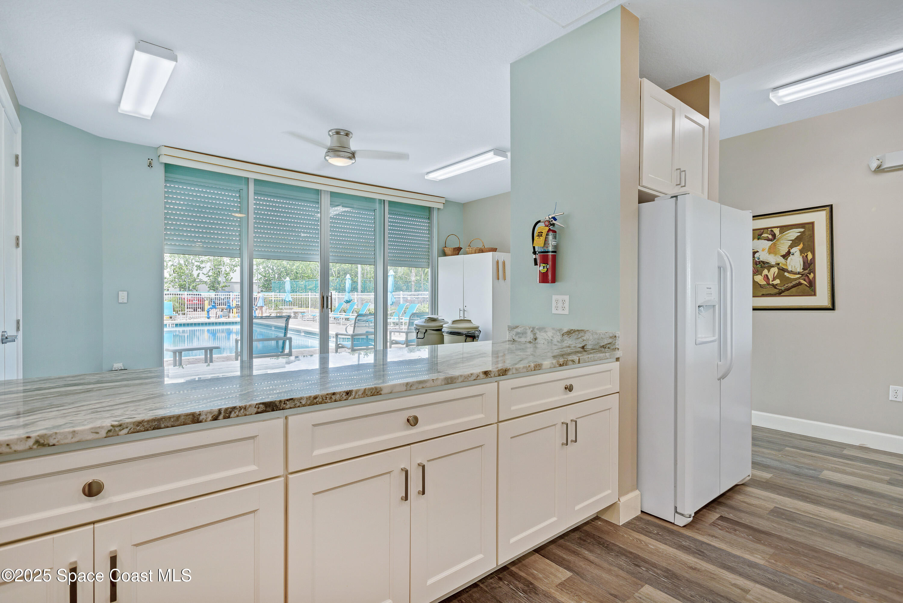3450 Ocean Beach Boulevard, Unit 201 Cocoa Beach, FL 32931 - Photo 44 of 48 a bathroom with a granite countertop sink mirror and window