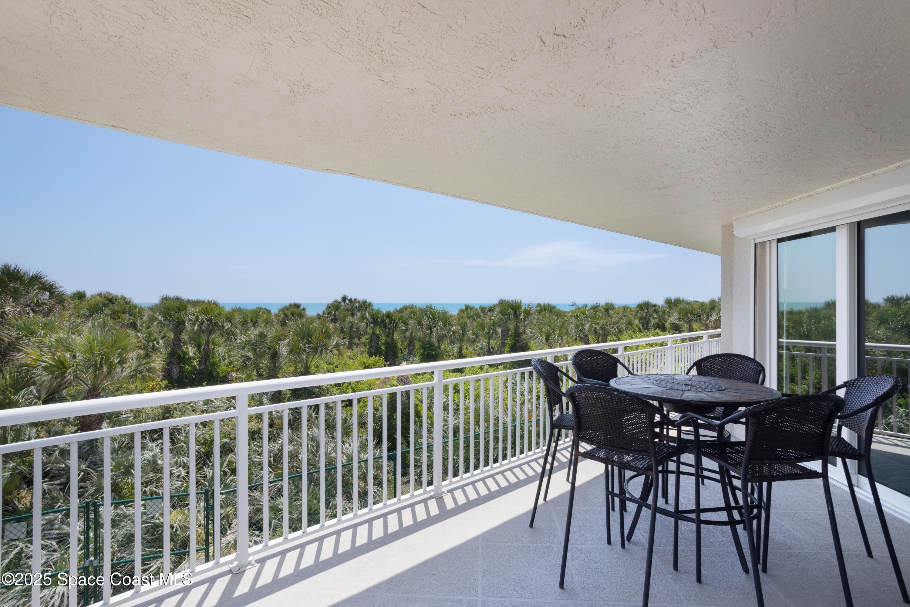 3450 Ocean Beach Boulevard, Unit 201 Cocoa Beach, FL 32931 - Photo 6 of 48 a view of a two chairs in the roof deck