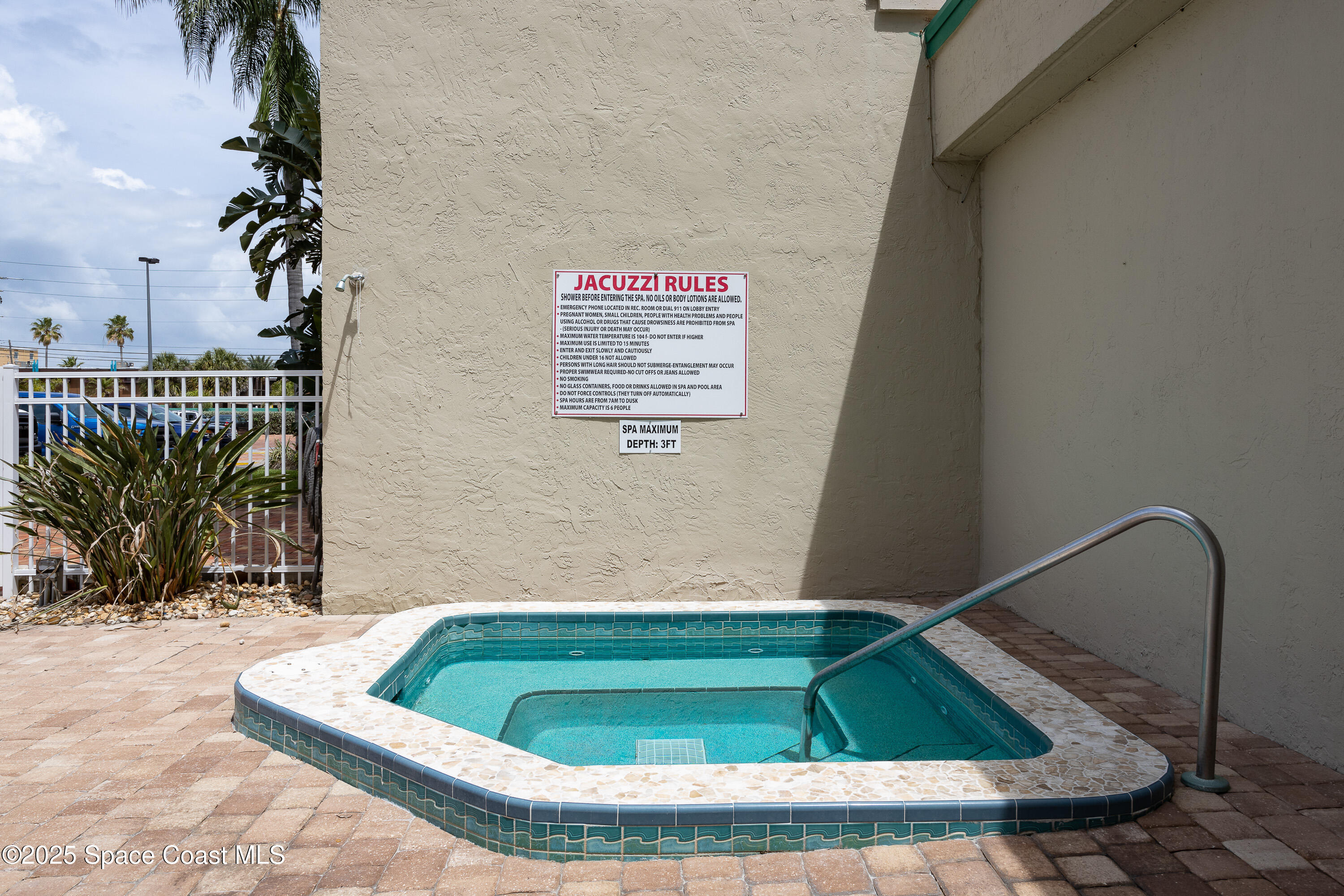 3450 Ocean Beach Boulevard, Unit 201 Cocoa Beach, FL 32931 - Photo 7 of 48 a small pool with some trees in it