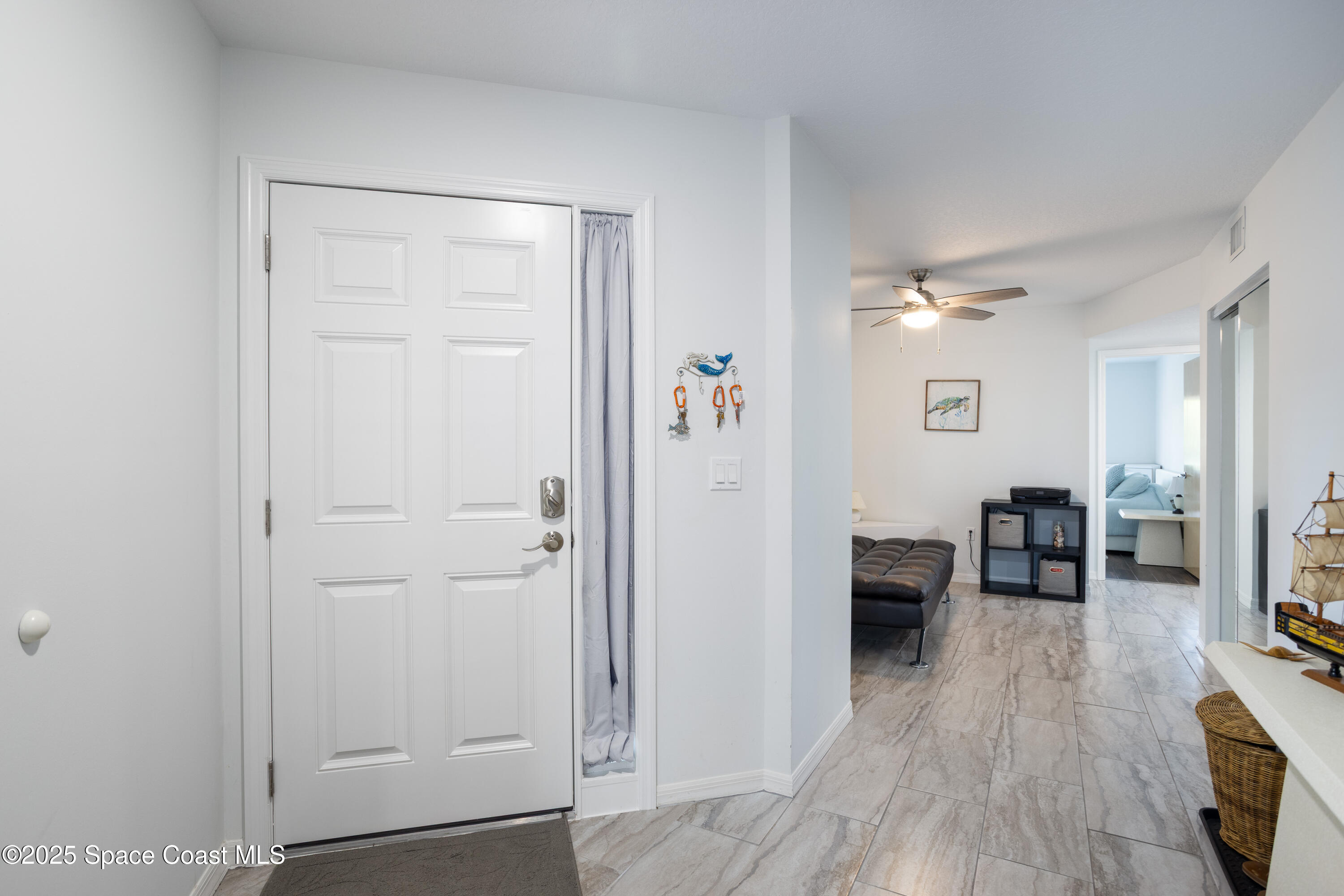 3450 Ocean Beach Boulevard, Unit 201 Cocoa Beach, FL 32931 - Photo 9 of 48 large foyer