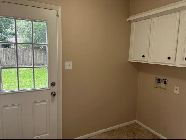 an empty room with wooden floor