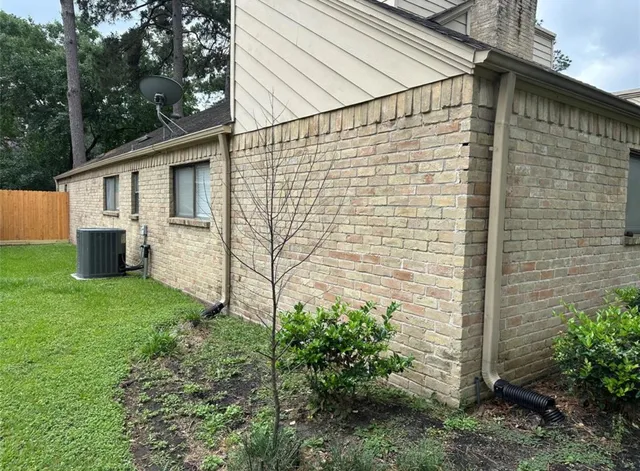 a view of an house with backyard space and garden