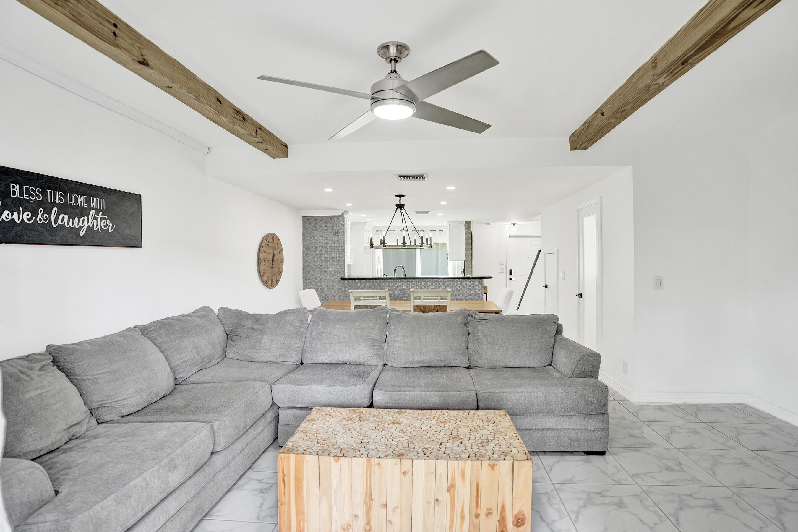 147 Southwest 3rd Street Pompano Beach, FL 33060 - Photo 10 of 29 a living room with furniture and a chandelier
