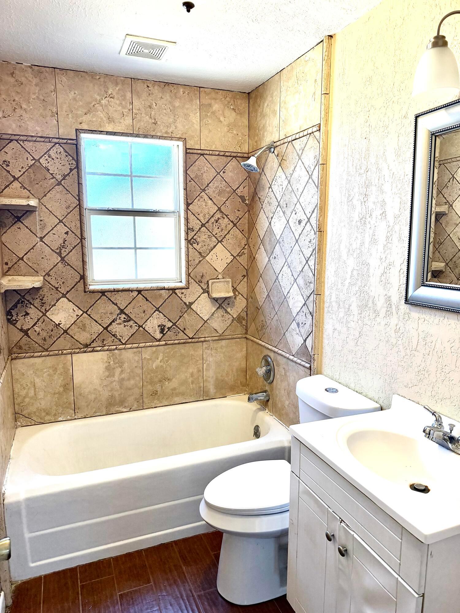 310 Coble Street Borger, TX 79007 - Photo 3 of 7 a bathroom with a sink toilet and bathtub