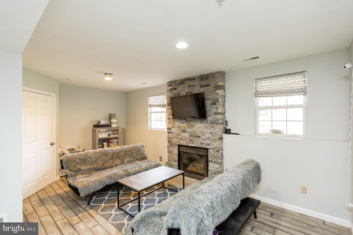 42912 Golf View Drive Chantilly, VA 20152 - Photo 27 of 39 Lower Level Living Area w/ Custom Fireplace