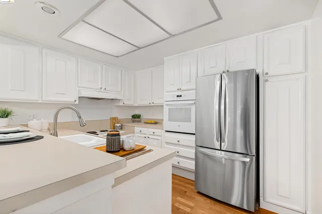 a kitchen with sink cabinets and stove