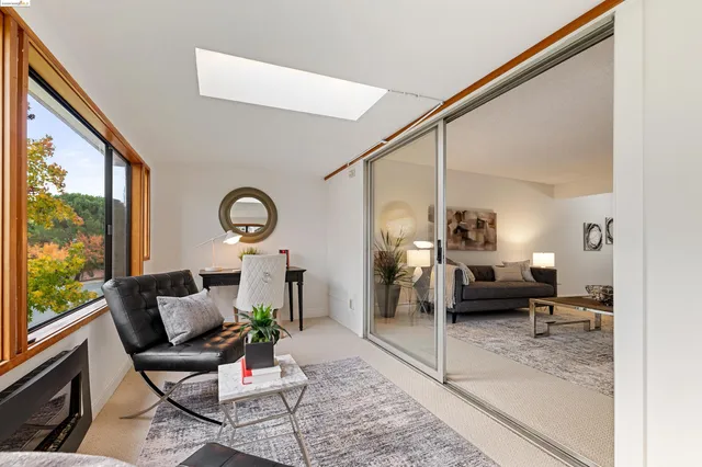 a view of a hallway with paintings on the wall