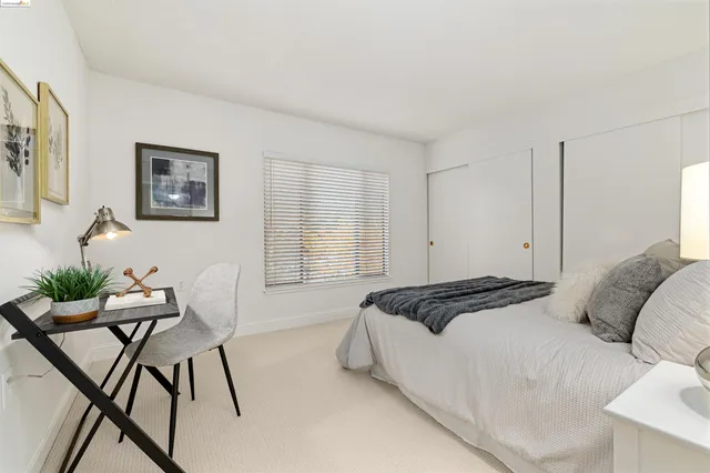 a bedroom with a bed and a cabinets