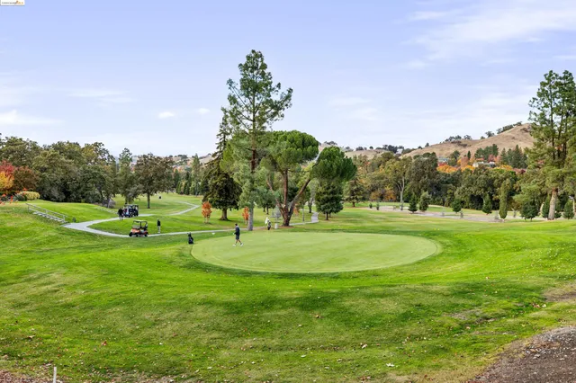 a view of street with parked cars