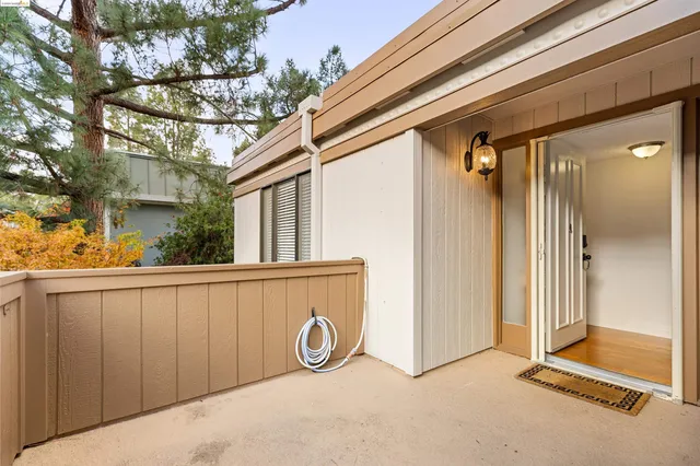 a view of a livingroom with furniture and a hallway
