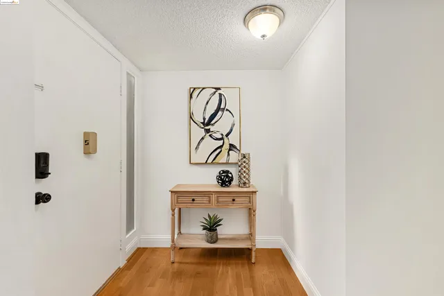 a view of a dining room and livingroom with furniture a chandelier