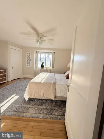 a spacious bedroom with a bed and a walk in closet