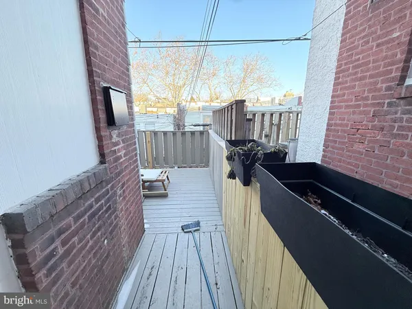 a view of balcony and wooden floor
