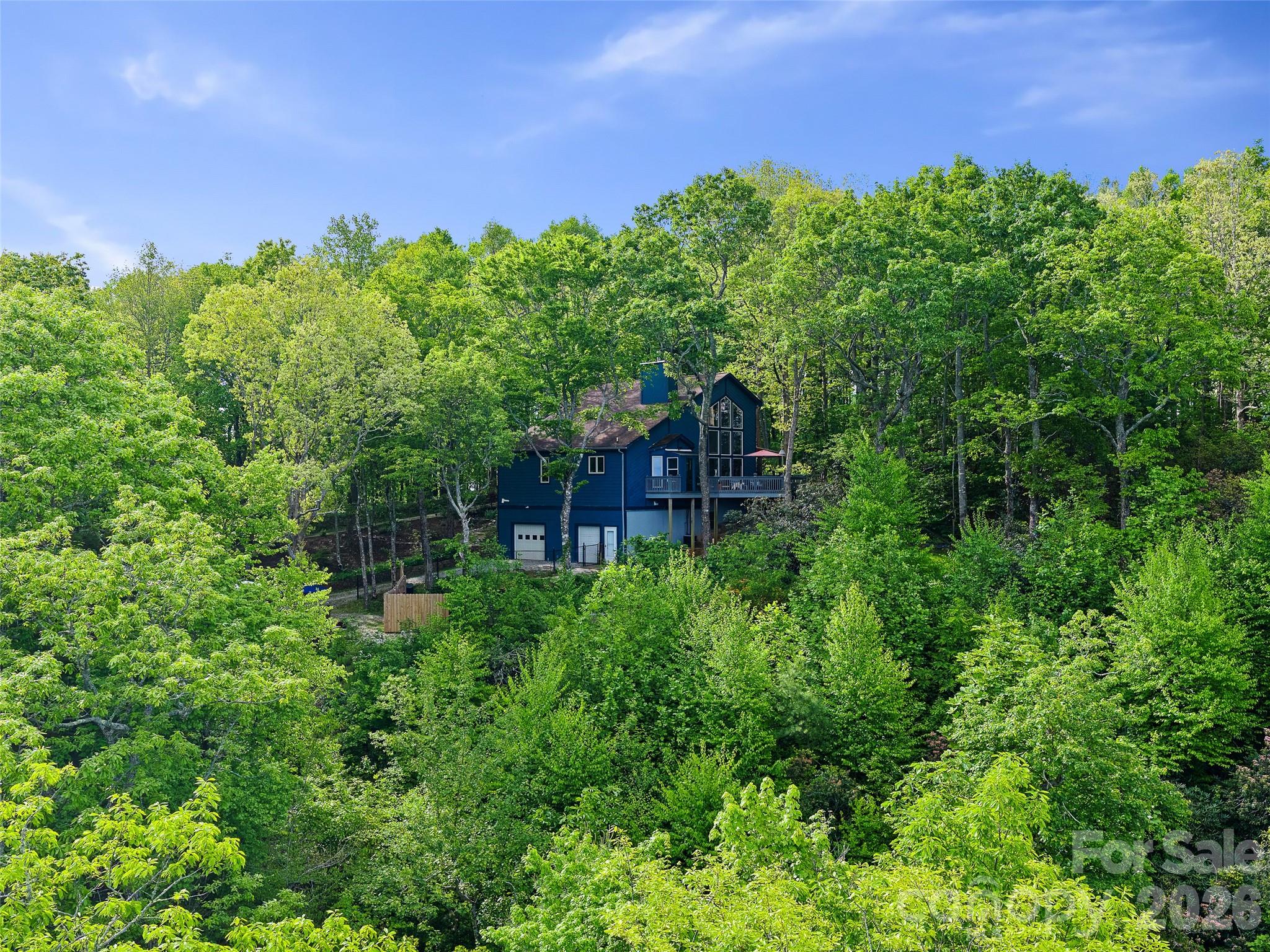 228 Continental Divide Road Spruce Pine, NC 28777 - Photo 44 of 48 a view of a house with a yard
