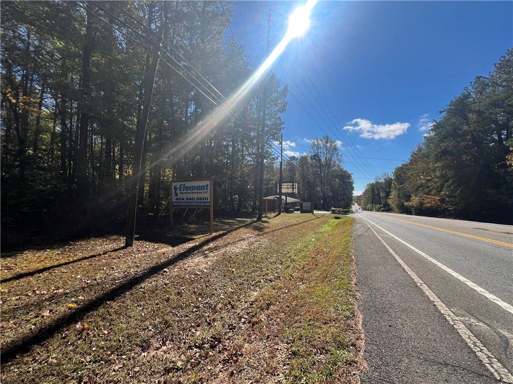 10494 Ball Ground Highway Ball Ground, GA 30107 - Photo 3 of 11 a view of a backyard of the house