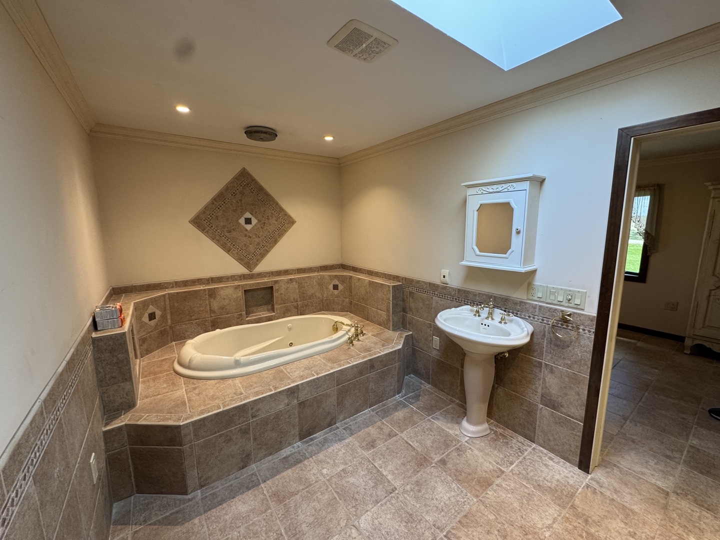 4340 230th Street Walcott, IA 52773 - Photo 30 of 67 a bathroom with a sink and a mirror