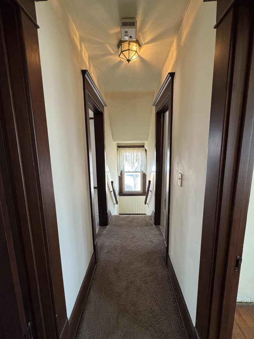 4340 230th Street Walcott, IA 52773 - Photo 42 of 67 a view of hallway with window and stairs