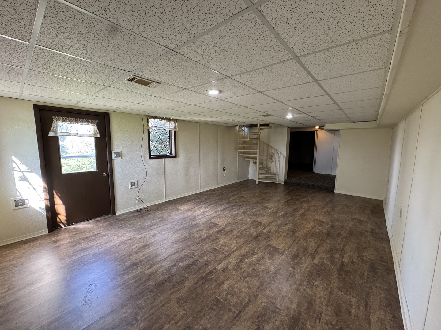 4340 230th Street Walcott, IA 52773 - Photo 44 of 67 an empty room with wooden floor and windows