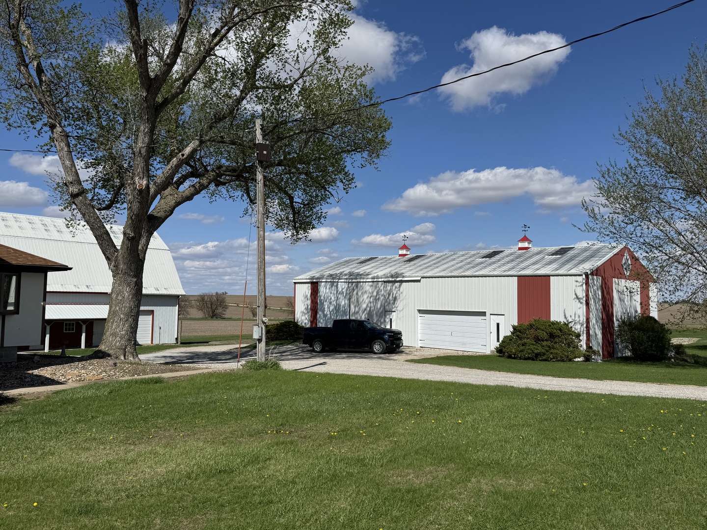 4340 230th Street Walcott, IA 52773 - Photo 58 of 67 a front view of house with yard and green space