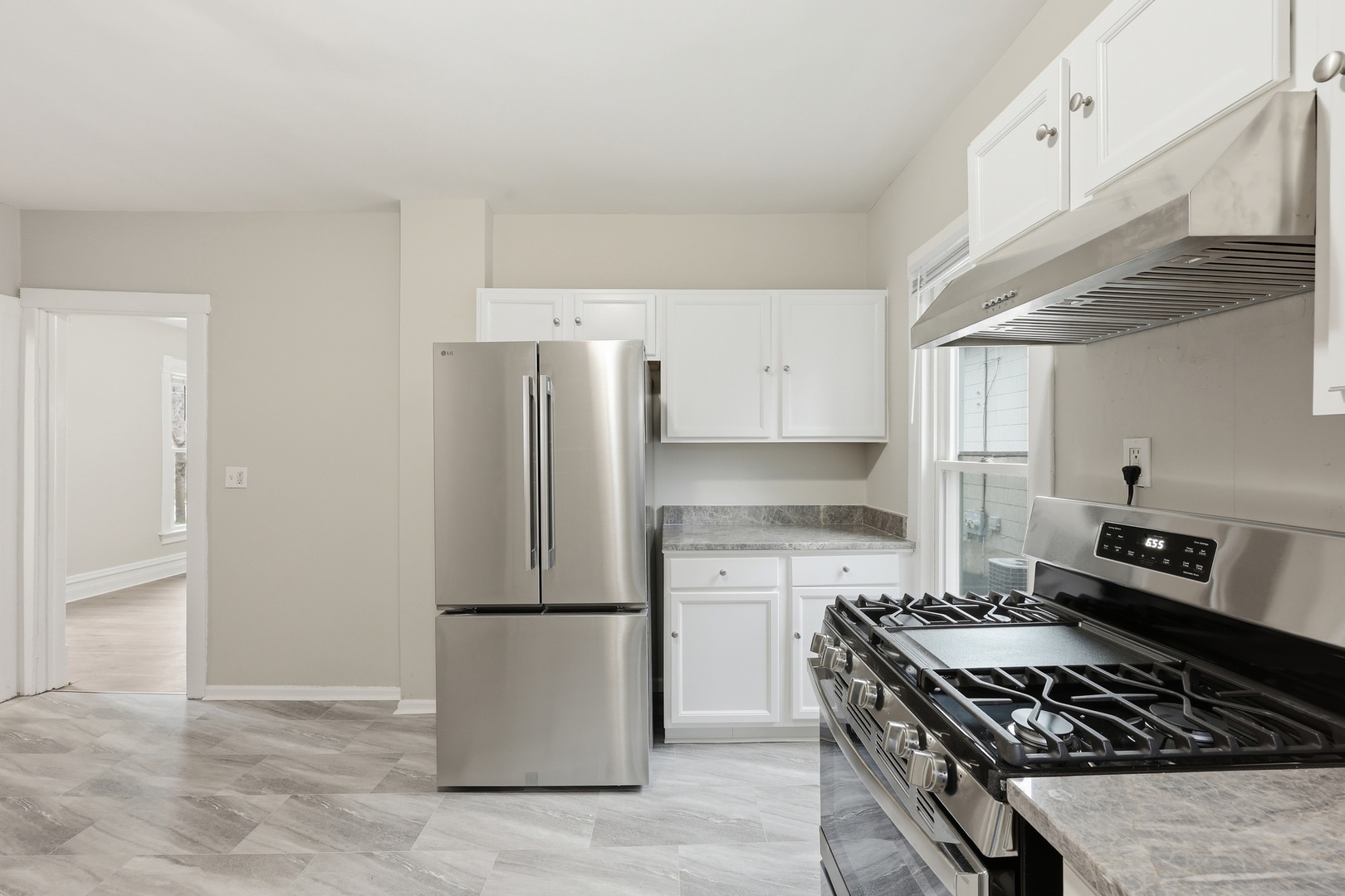835 Oak Street Elgin, IL 60123 - Photo 16 of 41 a kitchen with a refrigerator and a stove