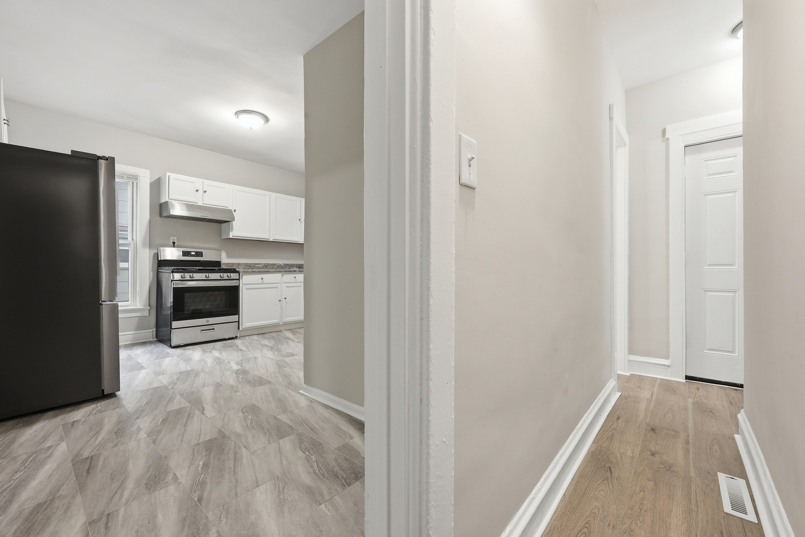 835 Oak Street Elgin, IL 60123 - Photo 18 of 41 a view of a kitchen from a hallway