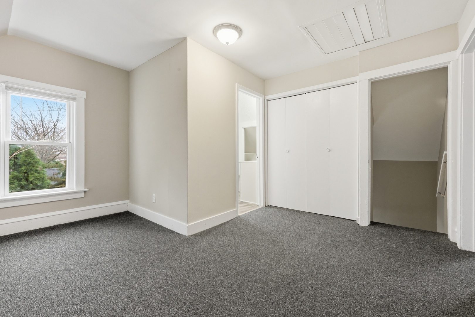 835 Oak Street Elgin, IL 60123 - Photo 23 of 41 a view of an empty room with a window