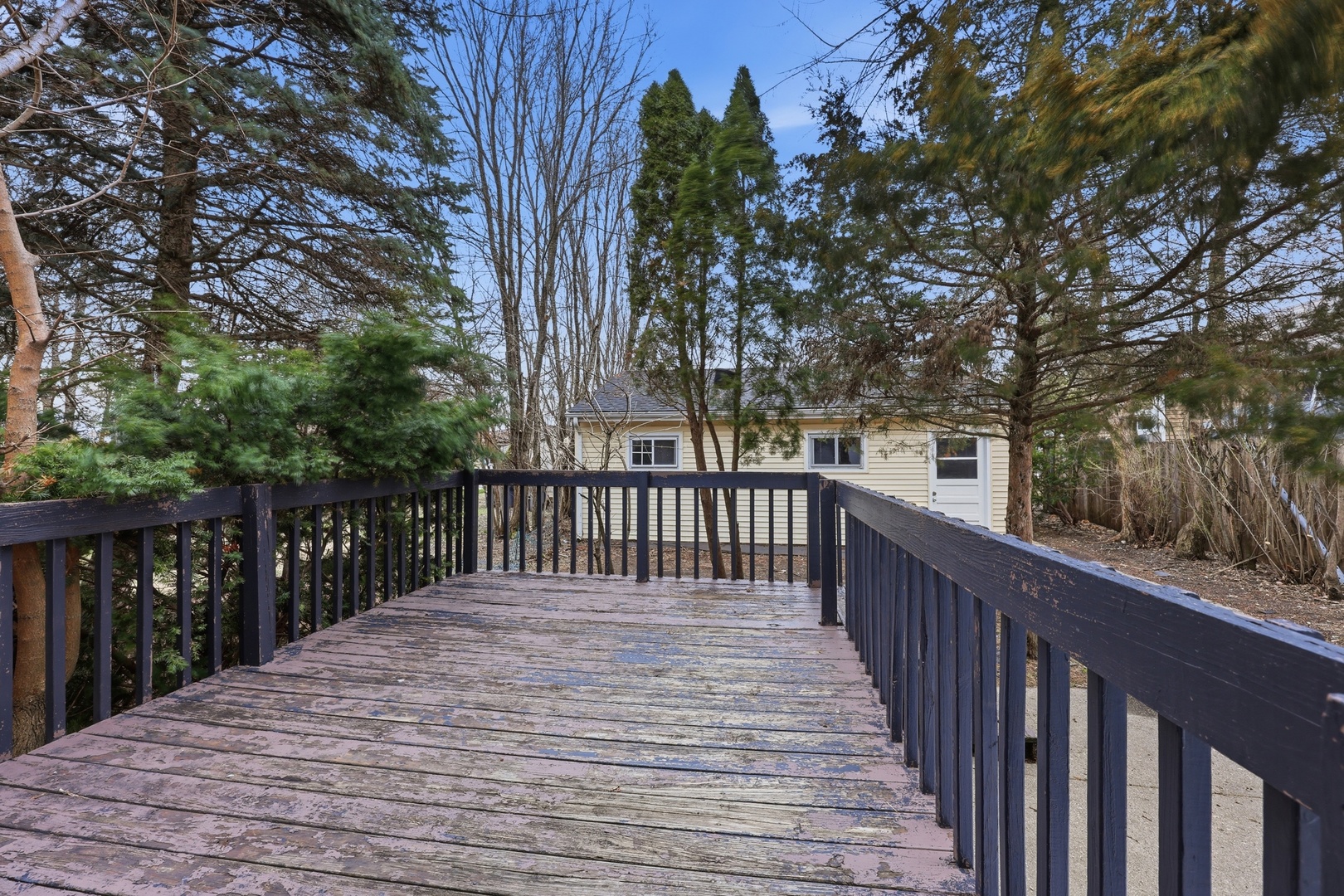 835 Oak Street Elgin, IL 60123 - Photo 32 of 41 a balcony with wooden floor and fence