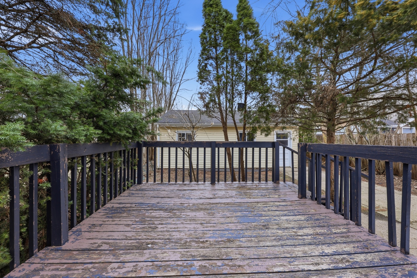 835 Oak Street Elgin, IL 60123 - Photo 33 of 41 a balcony with wooden floor and fence