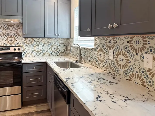 a kitchen with a sink and cabinets